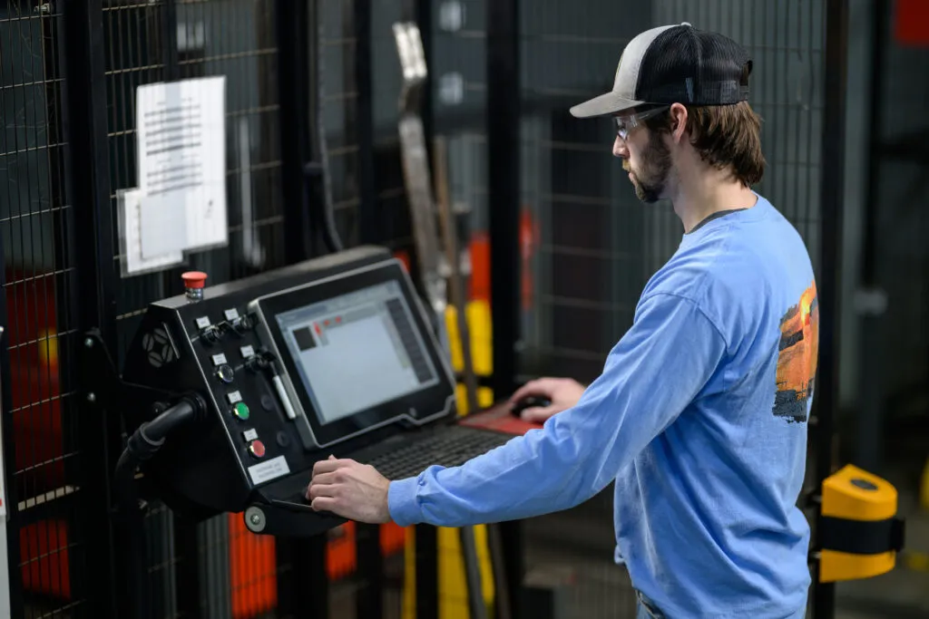 Hartness Man Working in factory on screen Hartness Man Working in factory on screen
