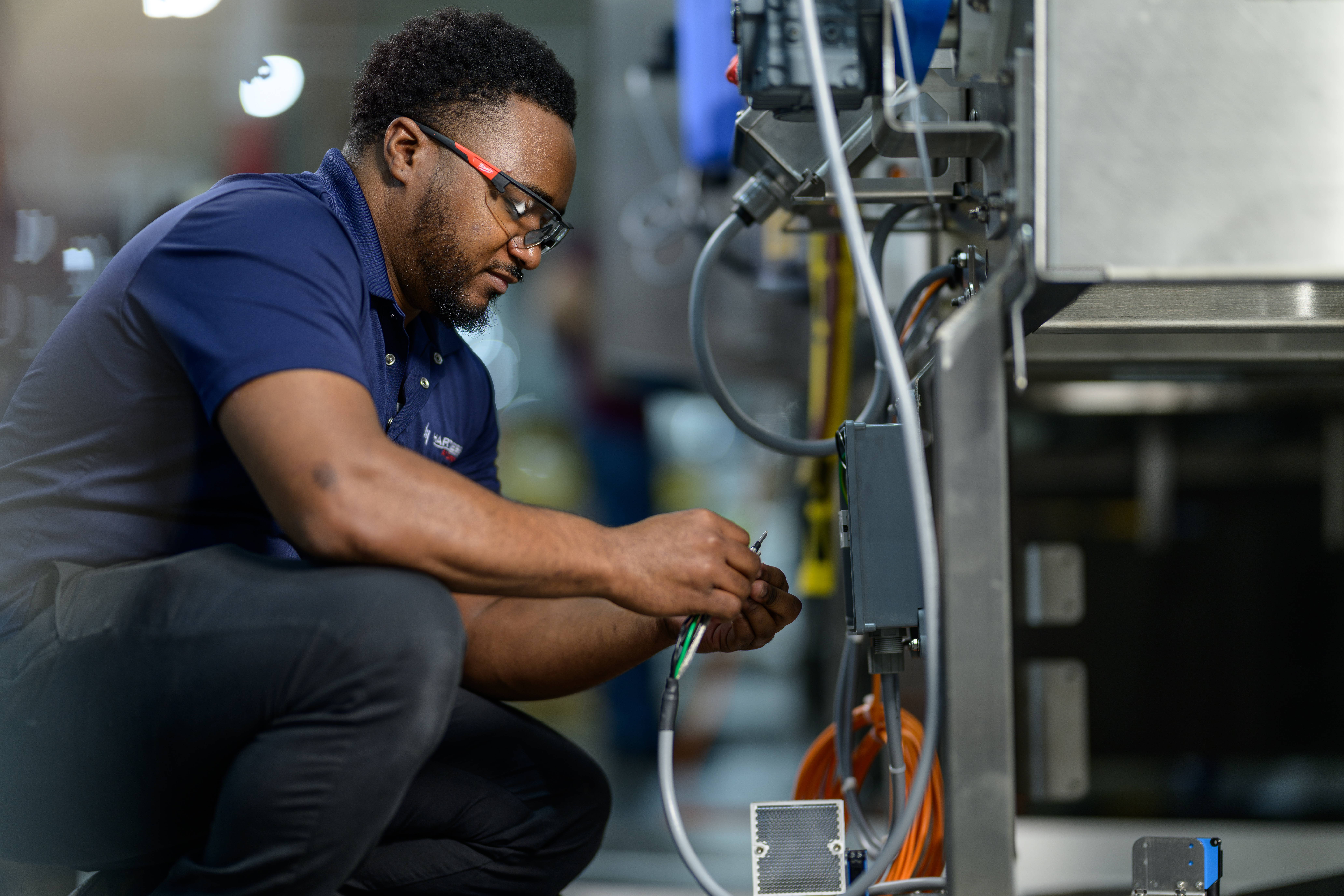 Workers discuss assembly line